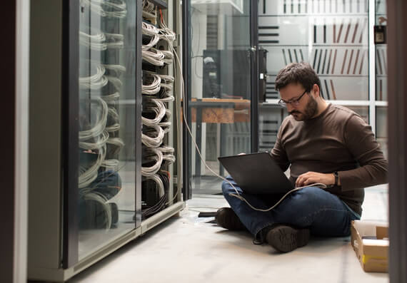 Employee Working On A Server Rack